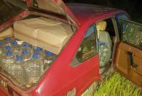 В Донецкой области в заброшенном авто нашли большое количество сигарет и спирта